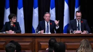 Quebec Premier François Legault, Christine Fréchette, left, and French Language Minister Jean-François Roberge, right - Photo: Jacques Boissinot/The Canadian Press